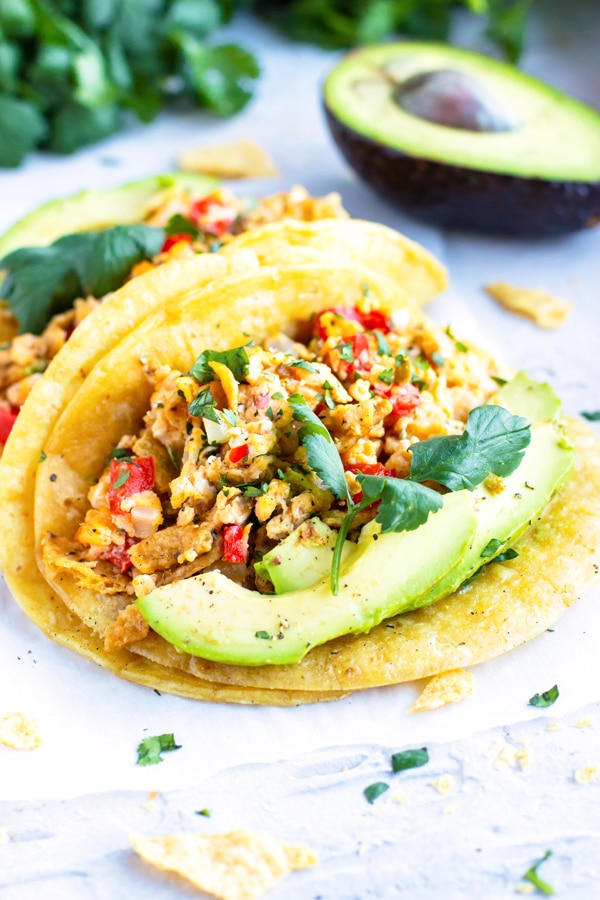 Learn how to make migas and serve them in a corn tortilla.