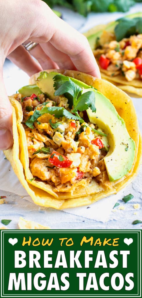 Two migas tacos on a white background with an avocado.