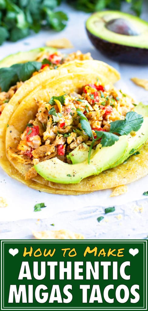 Two corn tortillas full of a healthy migas recipe with cilantro and avocado as garnished.
