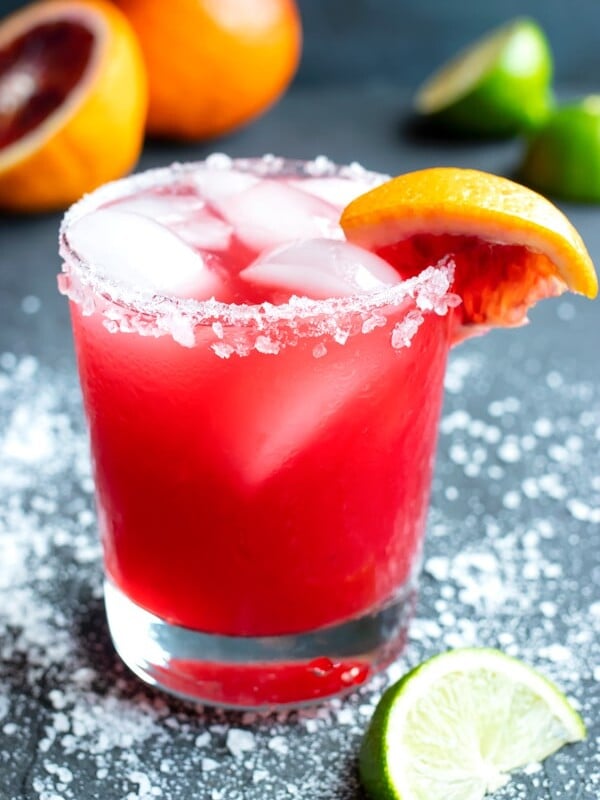 A homemade skinny margarita with a salted rim and a blood orange wedge for garnish.