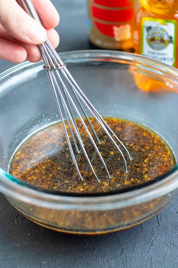 A glass bowl full of teriyaki sauce for a stir-fry recipe.