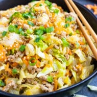 An easy and healthy keto dinner egg roll in a bowl recipe that is made of ground turkey or beef, cabbage, carrots, and Asian flavors.