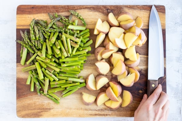 Chopped asparagus and red potatoes for a lemon garlic chicken breast recipe.