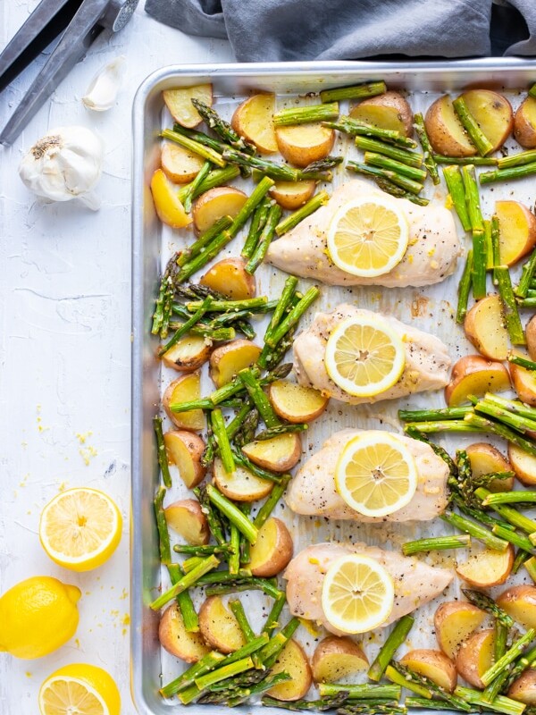 Lemon Garlic Chicken and Asparagus with Red Potatoes on a sheet pan.