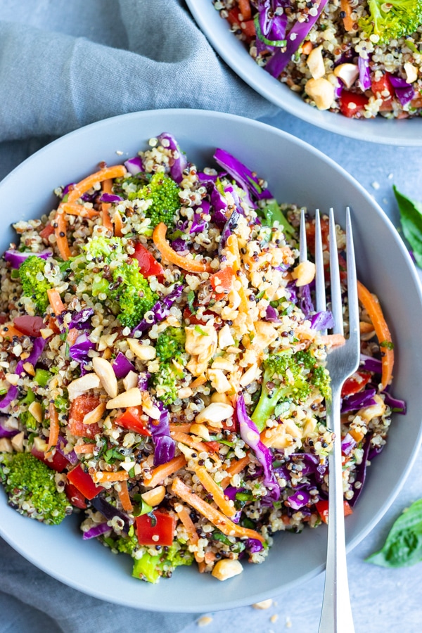 The best quinoa salad recipe with Thai peanut dressing, carrots, cabbage, and broccoli.