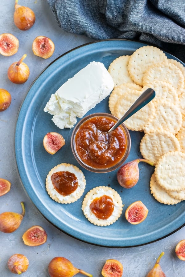 A fresh fig appetizer recipe of crackers, goat cheese, and homemade jam.