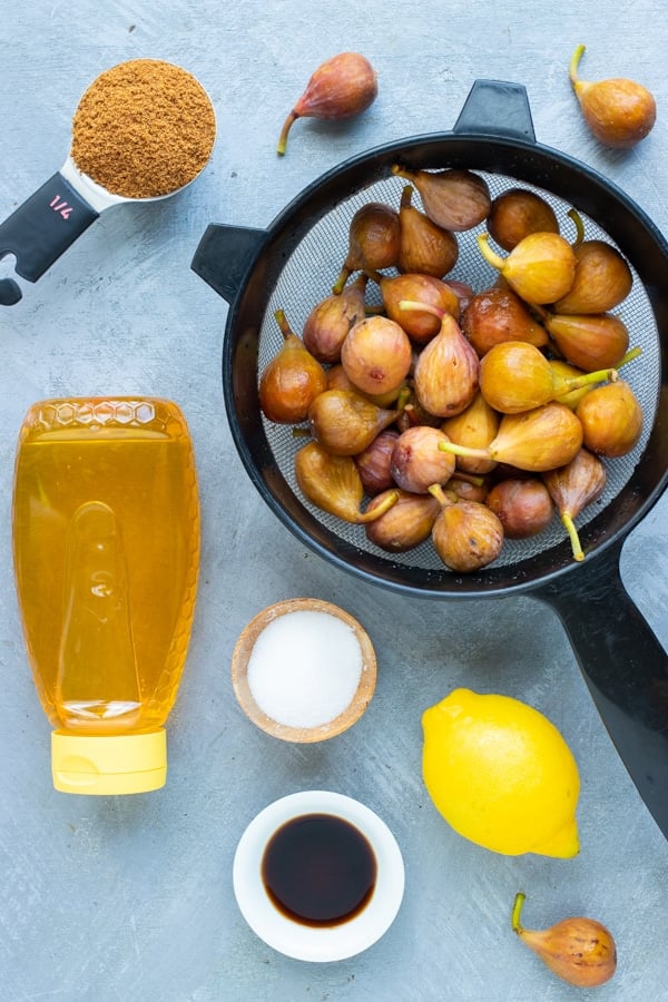 Figs, honey, coconut sugar, lemon juice, and vanilla as the ingredients in a homemade fig jam recipe.