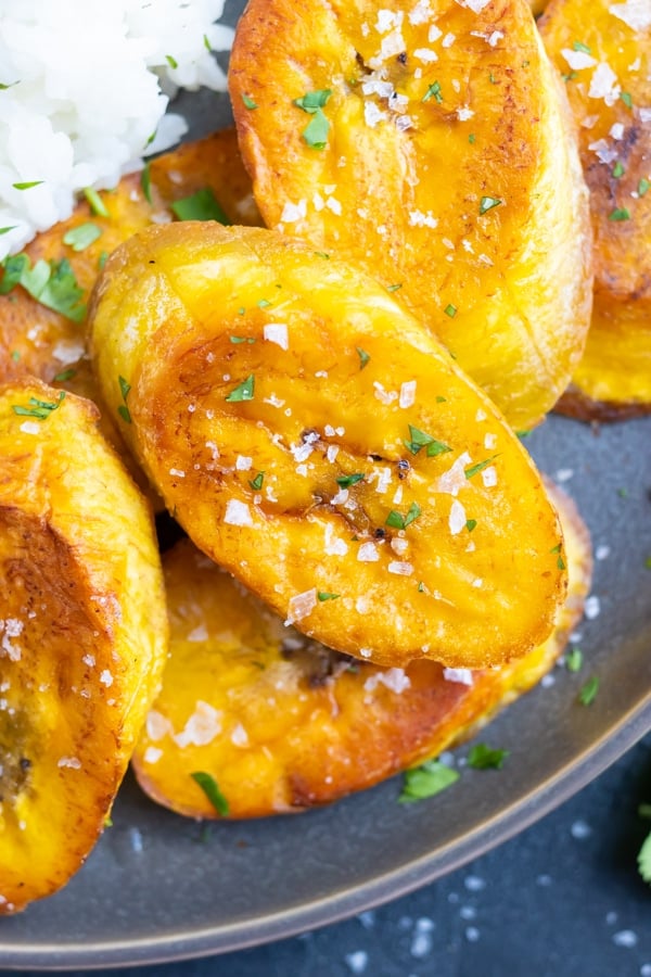 Crispy plantains that have been fried in coconut oil with a sprinkle of salt to serve.
