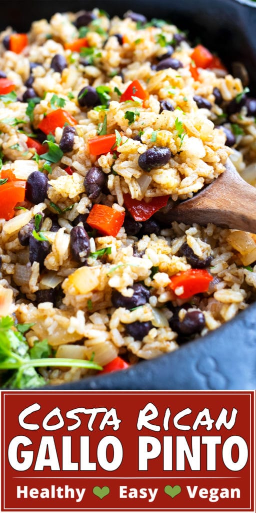 Black beans, rice, red bell peppers, and cilantro in a black skillet.