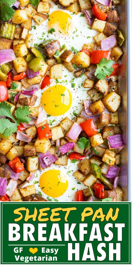 Roasted breakfast potatoes with bell peppers, onions, and eggs on a sheet pan.