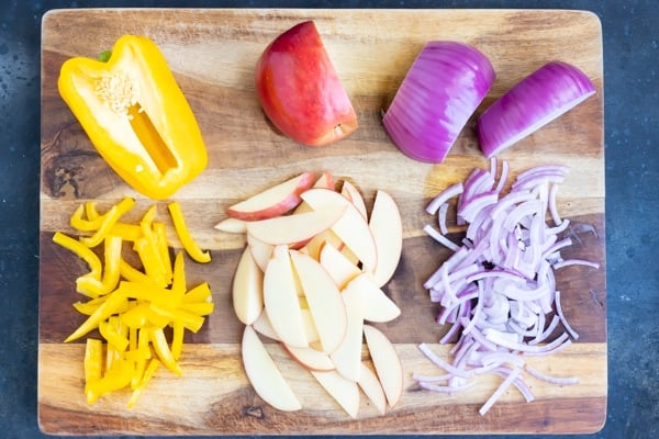 Red onion, bell pepper, and sliced apple for a Fall salad recipe.