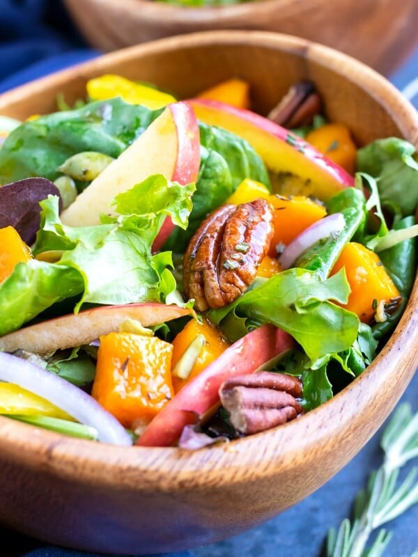 Mixed greens with pecans, apples, and butternuts squash topped with an apple cider vinaigrette salad dressing.