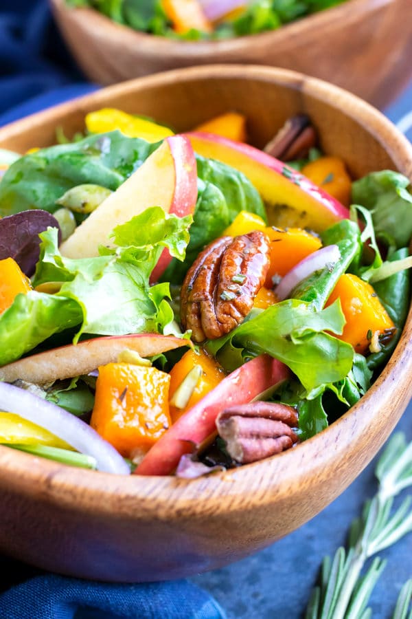 Mixed greens with pecans, apples, and butternuts squash topped with an apple cider vinaigrette salad dressing.