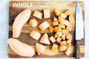Whole and peeled sweet potatoes and cubed sweet potatoes to show how long to boil sweet potatoes.