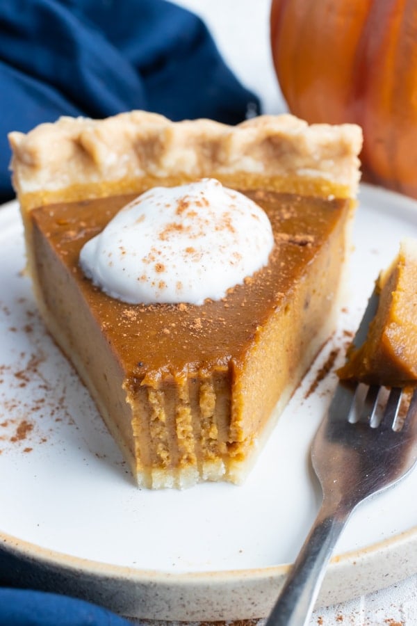 A creamy, pumpkin pie spiced filling with a flaky and buttery pie crust for a Thanksgiving dessert recipe.