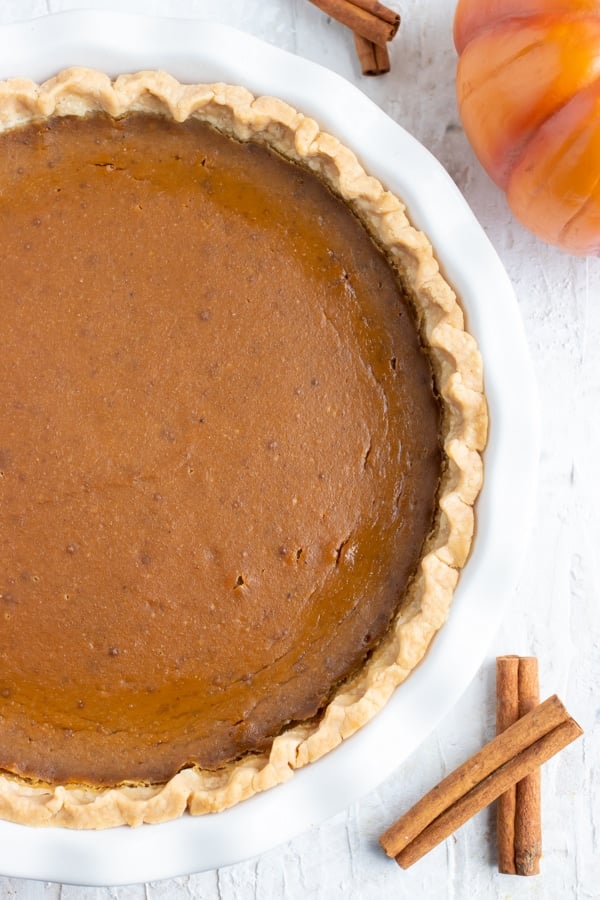 A 9-inch homemade pie crust full of a creamy, dairy-free, gluten-free, and vegan pumpkin pie filling.