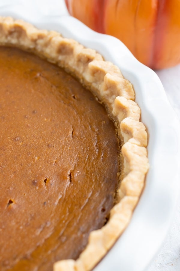 A 9-inch homemade pie crust full of a creamy, dairy-free, gluten-free, and vegan pumpkin pie filling.