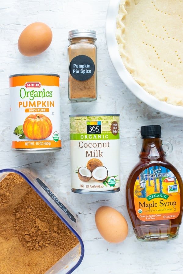 Canned pumpkin puree, pumpkin pie spice, coconut milk, maple syrup, eggs, and a flaky pie crust.