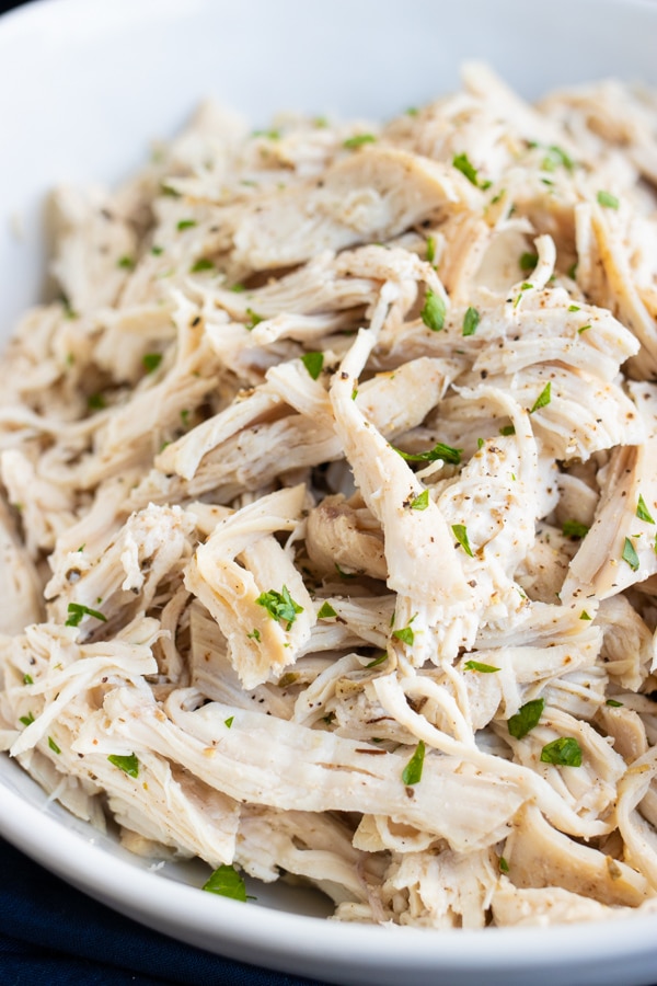Pressure cooker pulled chicken that will be used in a healthy dinner recipe.