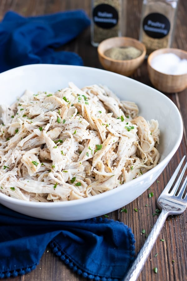 A bowl full of Instant Pot Shredded chicken.