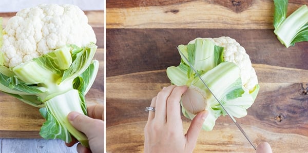 Trimming and removing the green leaves from a head of cauliflower.