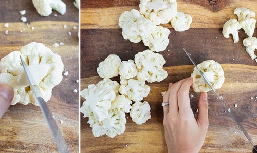 Chopping up large cauliflower florets into smaller florets.