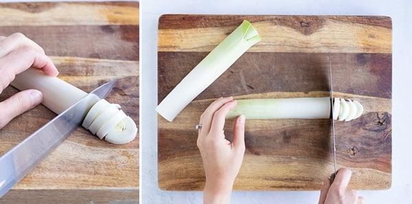A cutting board with a fresh leek on it and cutting it into round slices.
