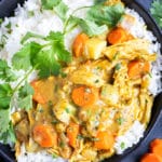 Instant Pot Chicken curry that is served on a bed of basmati rice.