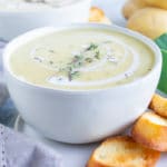 Vegan and vegetarian creamy potato soup that is made with fresh leeks and dried herbs.