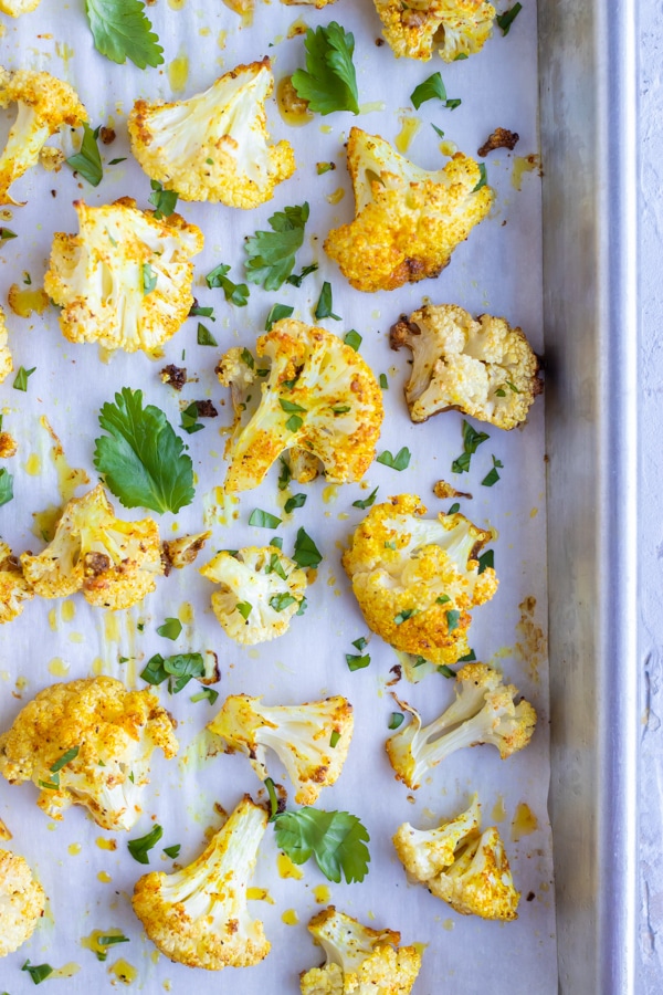Indian Curry Roasted Cauliflower with sprinkle of cilantro.