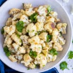 A large white bowl of a quick and easy roasted cauliflower recipe.