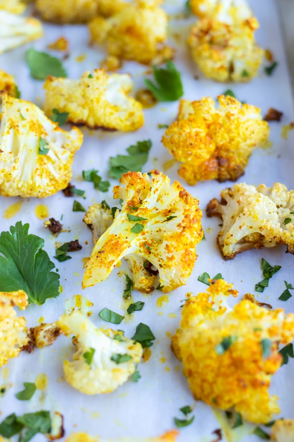 Indian Curry Roasted Cauliflower with sprinkles of fresh cilantro.