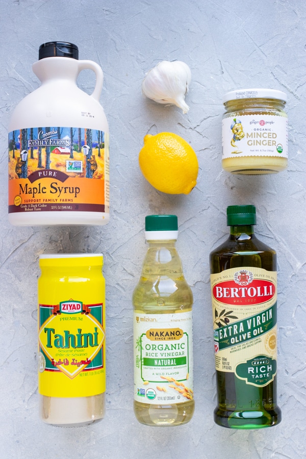 Tahini, maple syrup, lemon, garlic, olive oil, apple cider vinegar, and ginger- all the ingredients needed for lemon tahini dressing
