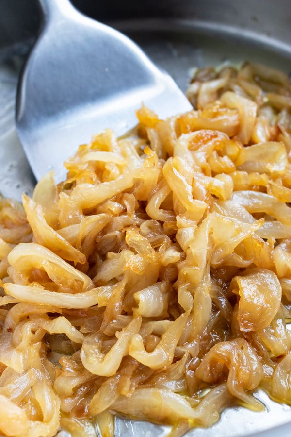 Perfectly golden, sweet, and savory caramelized onion recipe to add to steak or chicken.
