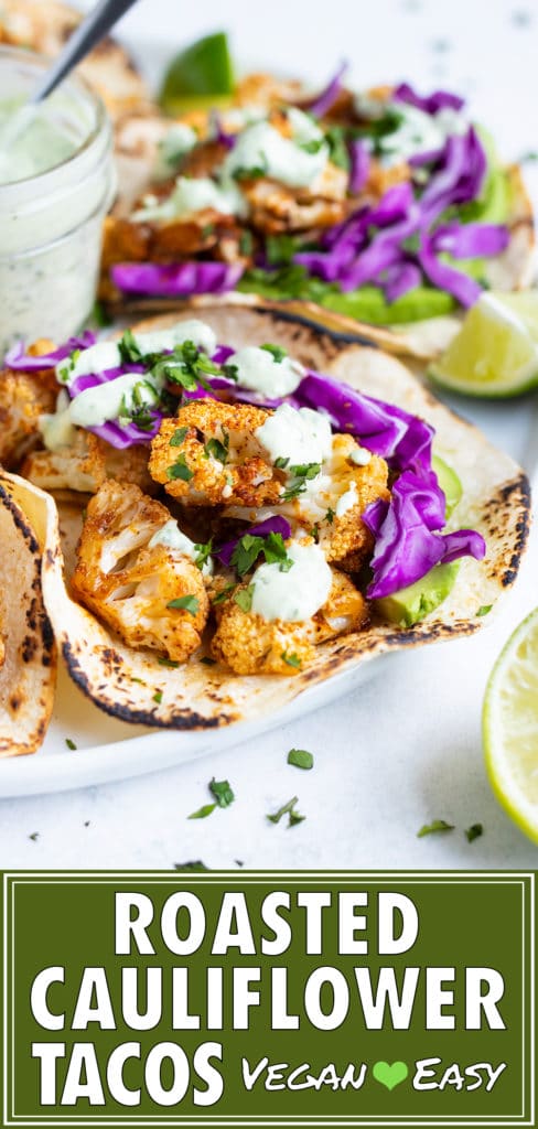 Vegan tacos that are full of roasted cauliflower, shredded red cabbage, avocado, and a cilantro lime sauce.