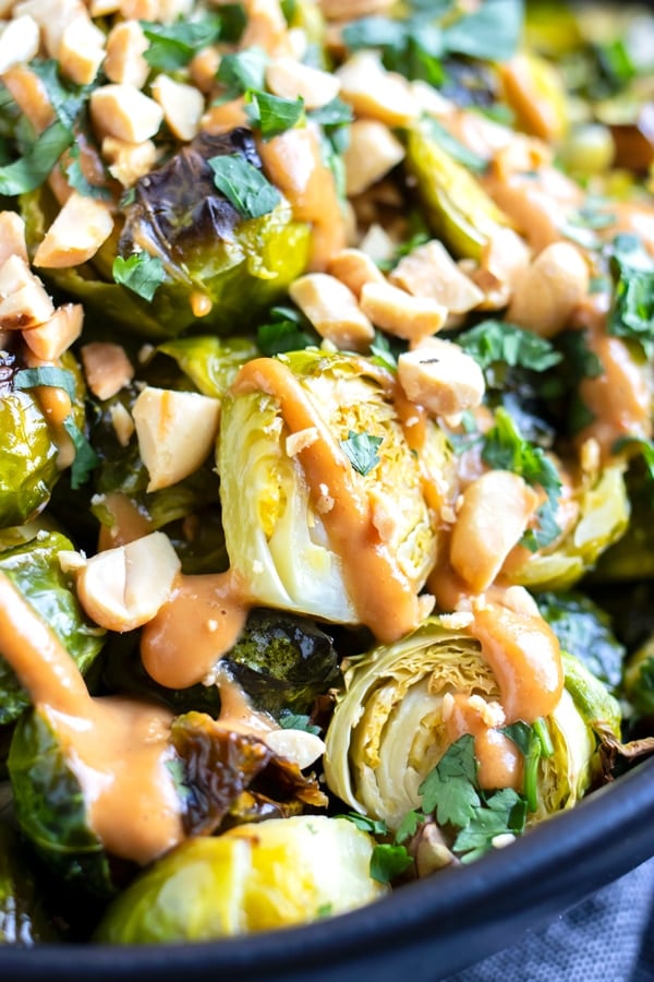 Crispy Brussels sprouts that have been roasted in the oven and drizzled with a creamy Asian sauce.