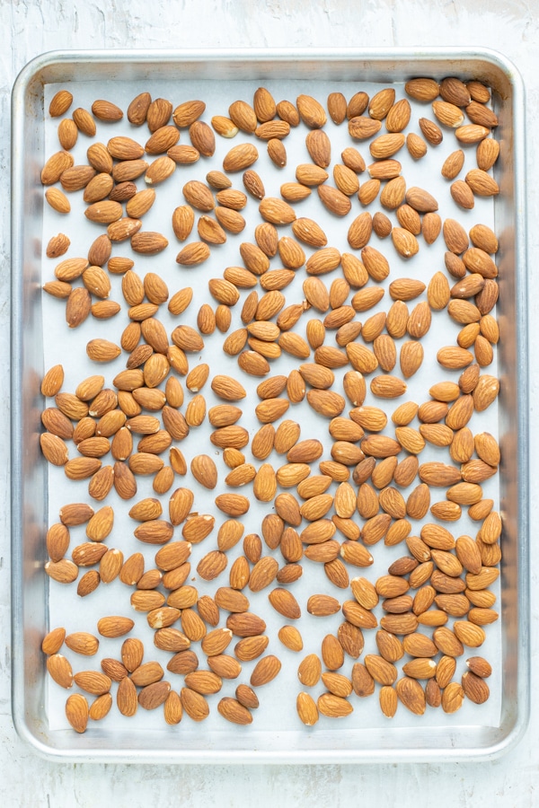 Whole almonds on a sheet pan.