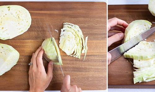 Shredding cabbage by thinly slicing it with a knife.
