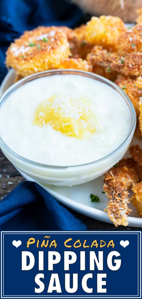 A white yogurt sauce with some crushed pineapple on top with a platter of coconut shrimp.