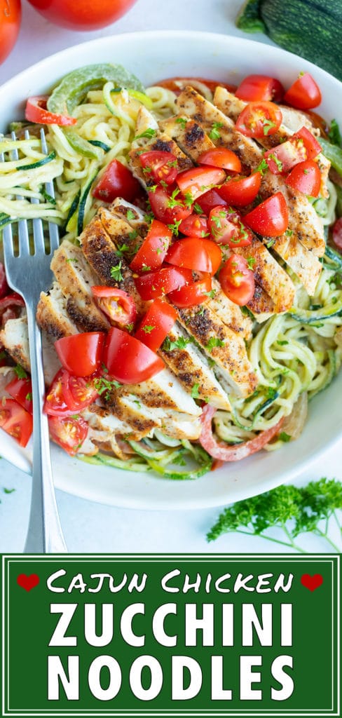 Seared cajun chicken is laid on a bed of vegetable pasta and topped with fresh tomatoes for an easy, low carb dinner.