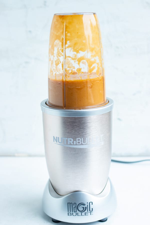Pineapple sauce ingredients are combined and mixed into a blender until completely smooth.