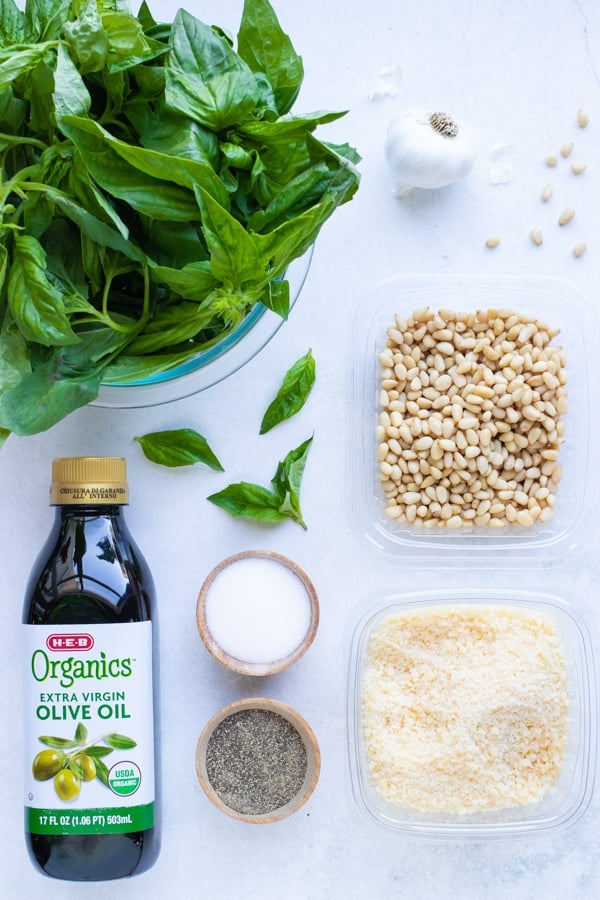 Fresh basil, olive oil, pine nuts, and parmesan cheese come together in a healthy, homemade basil pesto.