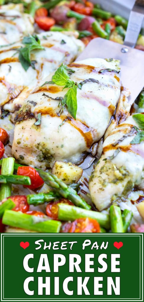 Cubed potatoes, sliced tomatoes and asparagus covered in pesto are cooked together with caprese chicken topped with melted mozzarella on a sheet pan and then drizzled with balsamic vinegar and sprinkled with fresh basil leaves.
