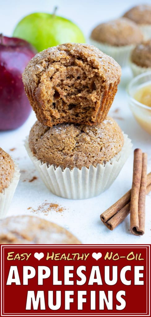 These soft and fluffy apple muffins are stacked on top of each other on the counter.