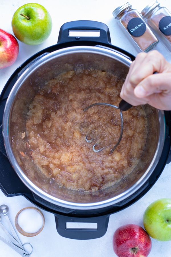 After pressure cooking apples, smash with a potato masher to desired texture.