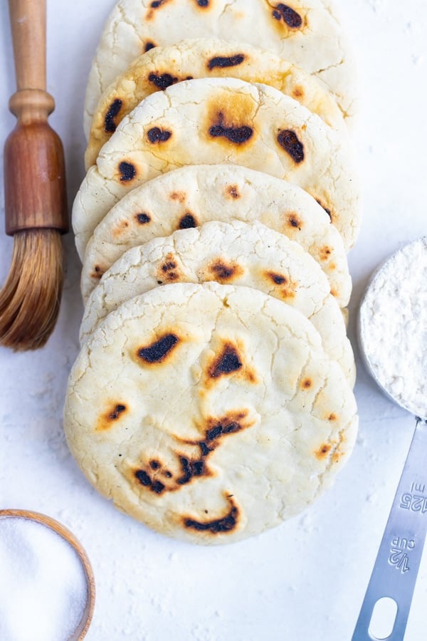 Homemade pita bread is placed on the counter before eating with Mediterranean recipes.