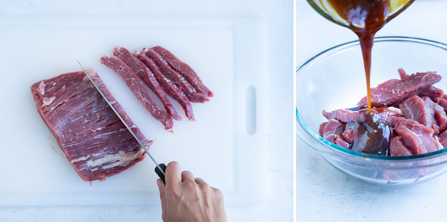 Flank steak is being thinly sliced on a cutting board and then marinated in teriyaki sauce.