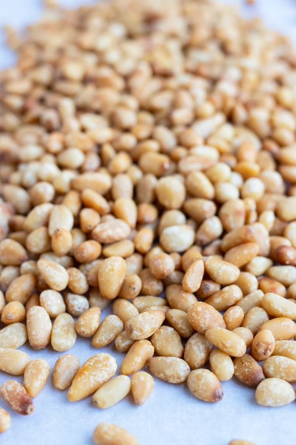 Golden, buttery pine nuts are roasted in the oven or in a pan on the stove.