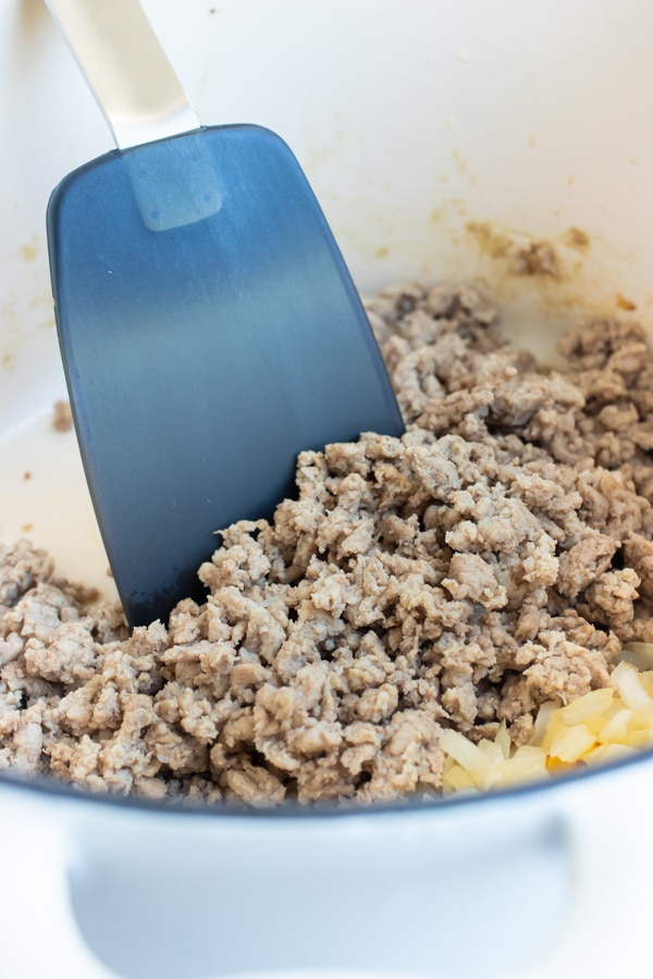 Add ground meat to the skillet with the sautéed onions.