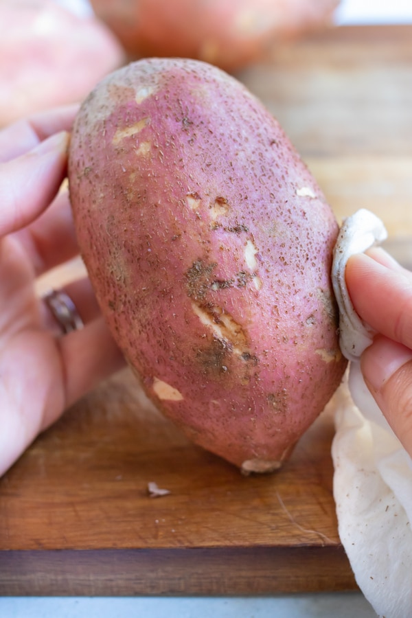 Sweet potatoes are washed for this side dish recipe.